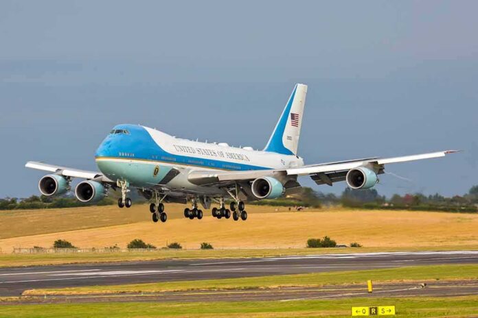 Airplane landing on runway with landing gear extended