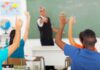 Schools vs. Parents Erupts Over ‘Adultism’ Push Students raising hands in a classroom while teacher points