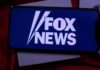 Fox Scramble After Explosive Smear smartphone displaying Fox News logo on screen