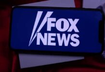 Fox Scramble After Explosive Smear smartphone displaying Fox News logo on screen