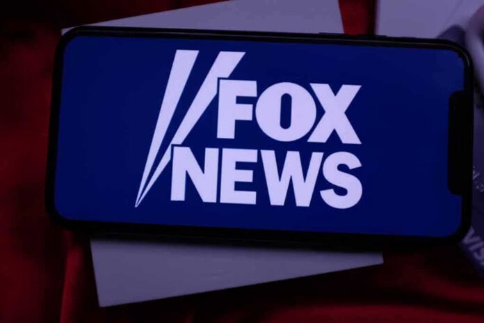 shutterstock_1522316513 smartphone displaying Fox News logo on screen