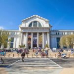 White House Targets Museum — Funding On The Line Neoclassical museum building with columns and busy entrance