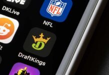 Addiction Surge Shadows Sports Betting Gold Rush Smartphone screen showing NFL and DraftKings app icons