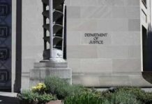 Billion‑Dollar Dragnet Targets Tariff Cheats Department of Justice building exterior with stone facade and plants