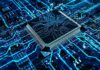 Microchip on a glowing blue circuit board