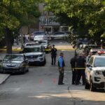 Terrifying Threat Targets Governor’s Kids Police officers secure a residential street with patrol cars and yellow tape