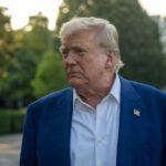 Deep State Smoke? Declassified Docs Ignite Fury A political figure with a serious expression standing outdoors near the White House