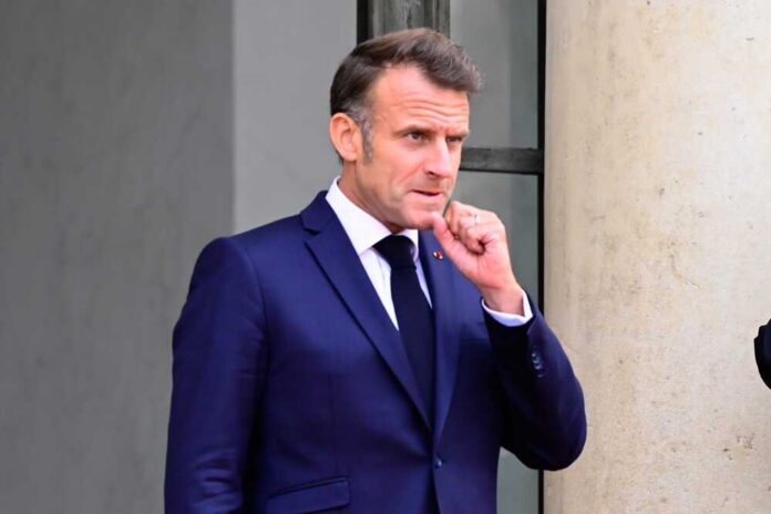 Paris,,France,-,July,14,2025,:,French,President,Emmanuel Emmanuel Macron in a suit, standing outdoors with a thoughtful expression