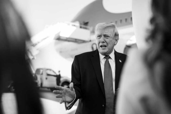 President,Donald,J.,Trump,Boards,Air,Force,One,At,Palm A political figure speaking outdoors in front of an airplane