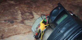 improvised device with phone and wires taped to a metal cylinder
