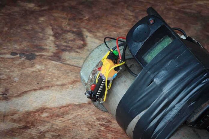 shutterstock_793068997 improvised device with phone and wires taped to a metal cylinder