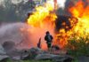 Citizen Clue Triggers $1M Arson Bust Firefighter battling a large fire with water spray
