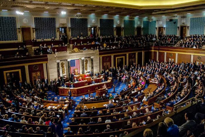 shutterstock_1186368262 legislative chamber filled with seated members during a session