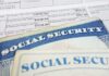 Social Security cards on top of a tax form