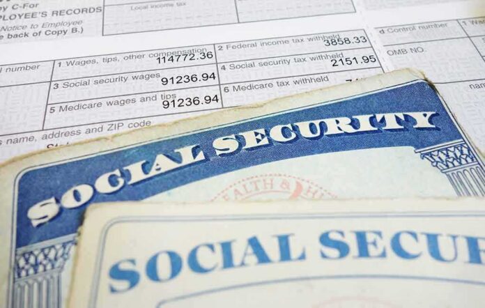 shutterstock_126890366 Social Security cards on top of a tax form