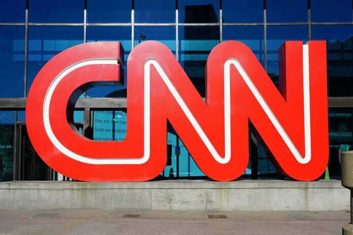 shutterstock_1284372031 CNN red logo sculpture outside a glass-fronted building