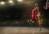 Ex-NBA Stars Test WNBA Loophole Two basketball players contest a layup under the hoop