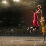 Two basketball players contest a layup under the hoop