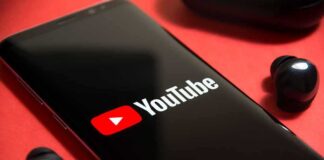 smartphone displaying YouTube logo on red background