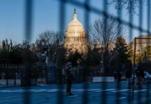 Pricey ‘Security Theater’ Drains Taxpayers U.S. Capitol behind security fencing and guards on a street