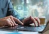 Teen Tragedy Triggers Nationwide Discord Freeze Hands typing on a laptop with AI chat icons