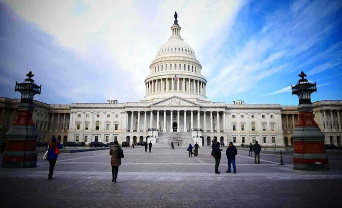 United States Capitol building with visitors on the plaza