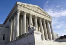 Judge Freezes Illinois Mandate For Nuns Supreme Court building with Corinthian columns
