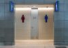 Locker Room Showdown Hits Federal Court Public restroom entrance with male and female symbols