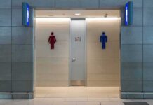 Public restroom entrance with male and female symbols