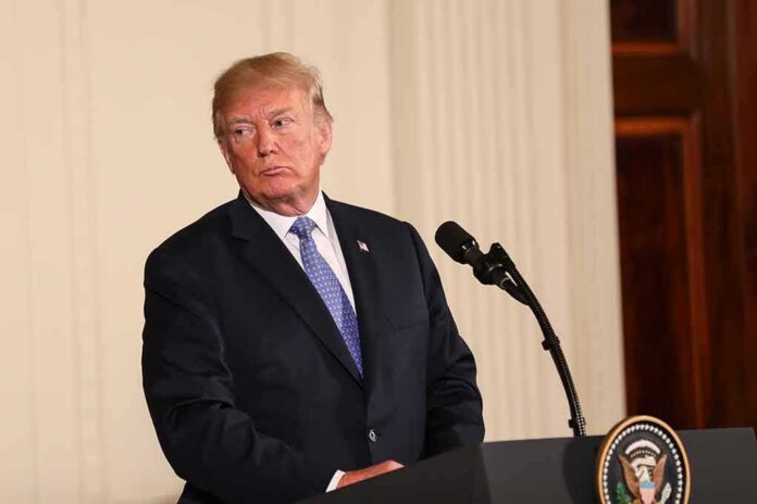 Donald Trump at a podium with microphone