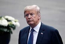 Trump Torpedoes Iran’s One-Week Gamble man in a suit with an American flag pin