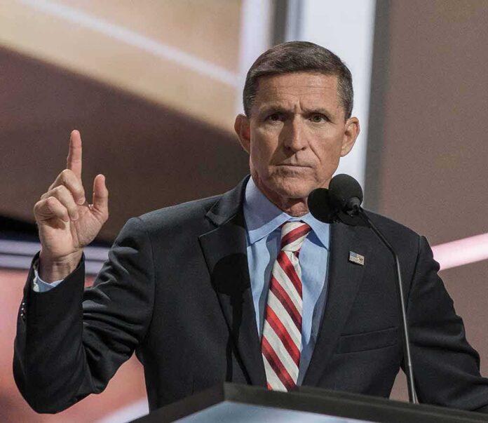 Michael Flynn speaking at a podium with a raised finger gesture