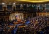 legislative chamber filled with seated delegates