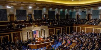 legislative chamber filled with seated delegates