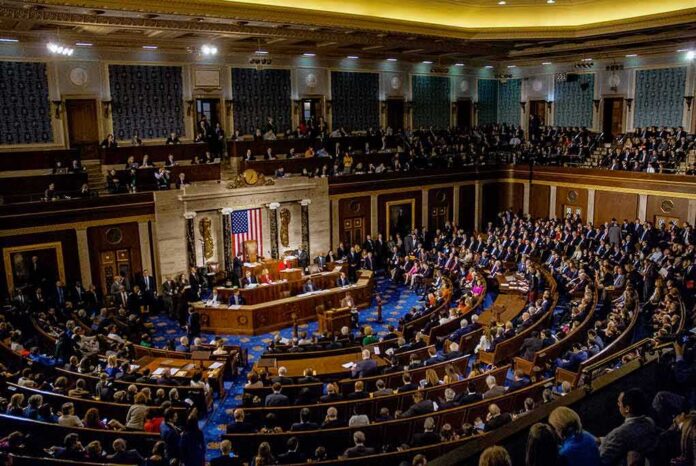 shutterstock_1186368274 legislative chamber filled with seated delegates