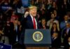 Election Cash? Trump Teases $5K Payout Donald Trump speaking at a rally behind a presidential podium