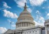 United States Capitol dome under a partly cloudy sky