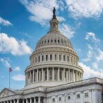 United States Capitol dome under a partly cloudy sky