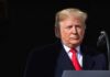 Trump Blames Kyiv For Price Spike Donald Trump at a podium with a microphone