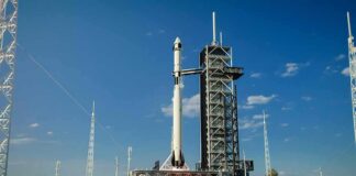 Rocket on launch pad under clear blue sky