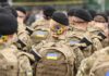 Air-Defense Drought Sparks Risky Hacks Soldiers in camouflage uniforms with berets and backpacks