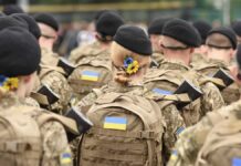 Air-Defense Drought Sparks Risky Hacks Soldiers in camouflage uniforms with berets and backpacks