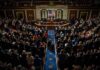 Ethics Bomb Blows Up Crypto Deal Legislative chamber audience stands and applauds