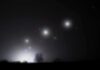 Pentagon Drops More UAP Bombshells Night sky over a silhouetted landscape with glowing orbs of light