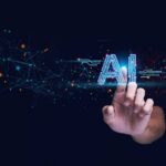 AI Control Slipping – Bengio Sounds Alarm Hand touching glowing AI text with digital network nodes