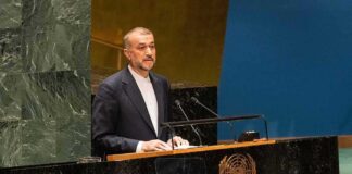 Speaker at United Nations podium delivering a address