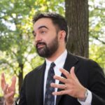 City Hall’s Influencer Machine Exposed Man in a suit gesturing while speaking outdoors