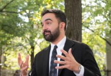 City Hall’s Influencer Machine Exposed Man in a suit gesturing while speaking outdoors