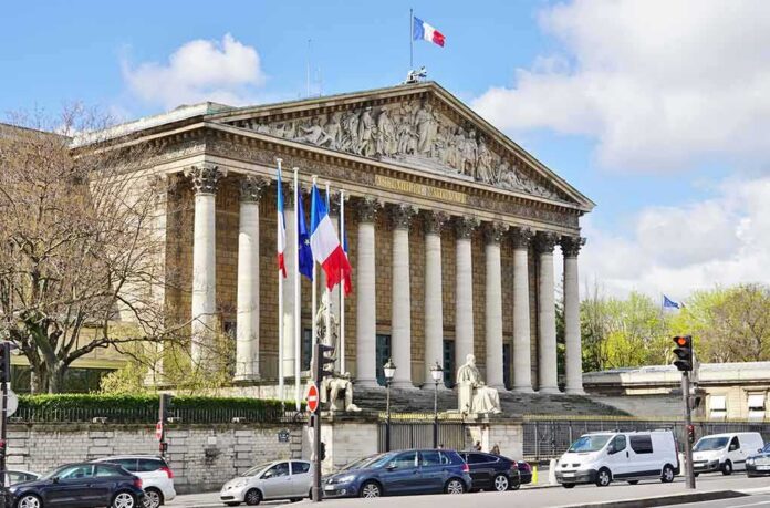 shutterstock_415628107 Neoclassical building with columns and French flags