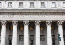 Border Boss Bolts Days After Probe United States courthouse facade with Corinthian columns